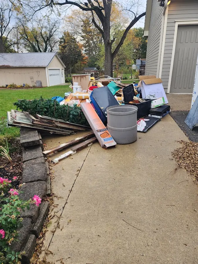 Dumpster being loaded with debris for Estate Cleanout Dumpster Rental in Livermore